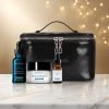 SkinCeuticals holiday kit on a white marble table