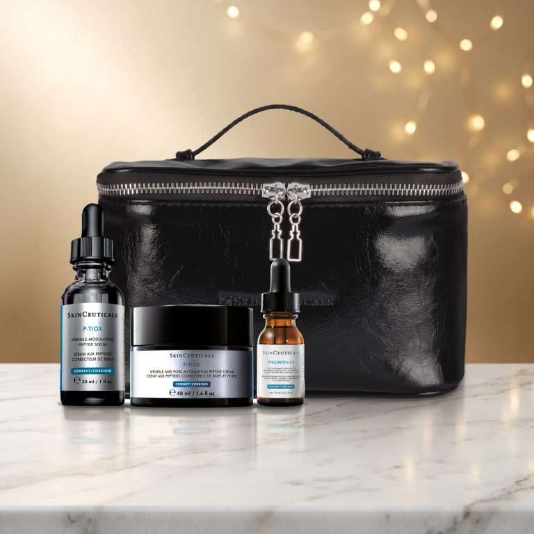 SkinCeuticals holiday kit on a white marble table