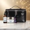 SkinCeuticals holiday kit on a white marble table